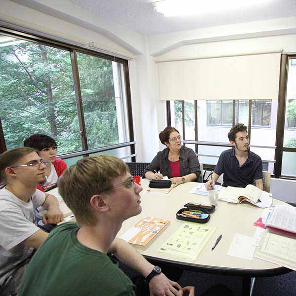 International students sitting at their desk in a classroom in GenkiJACS